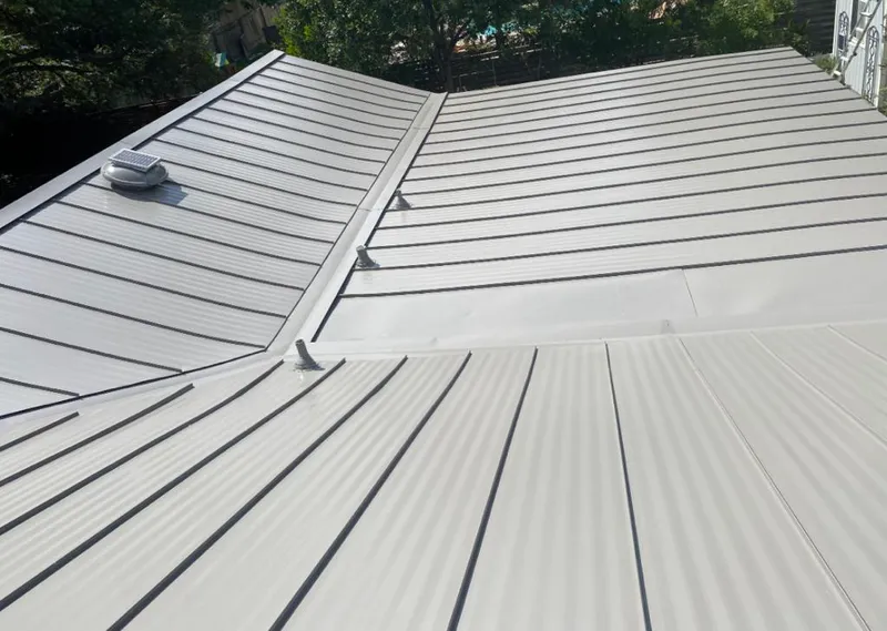 Solar attic fan installed on a metal roof for Roof Ventilation in Airmont